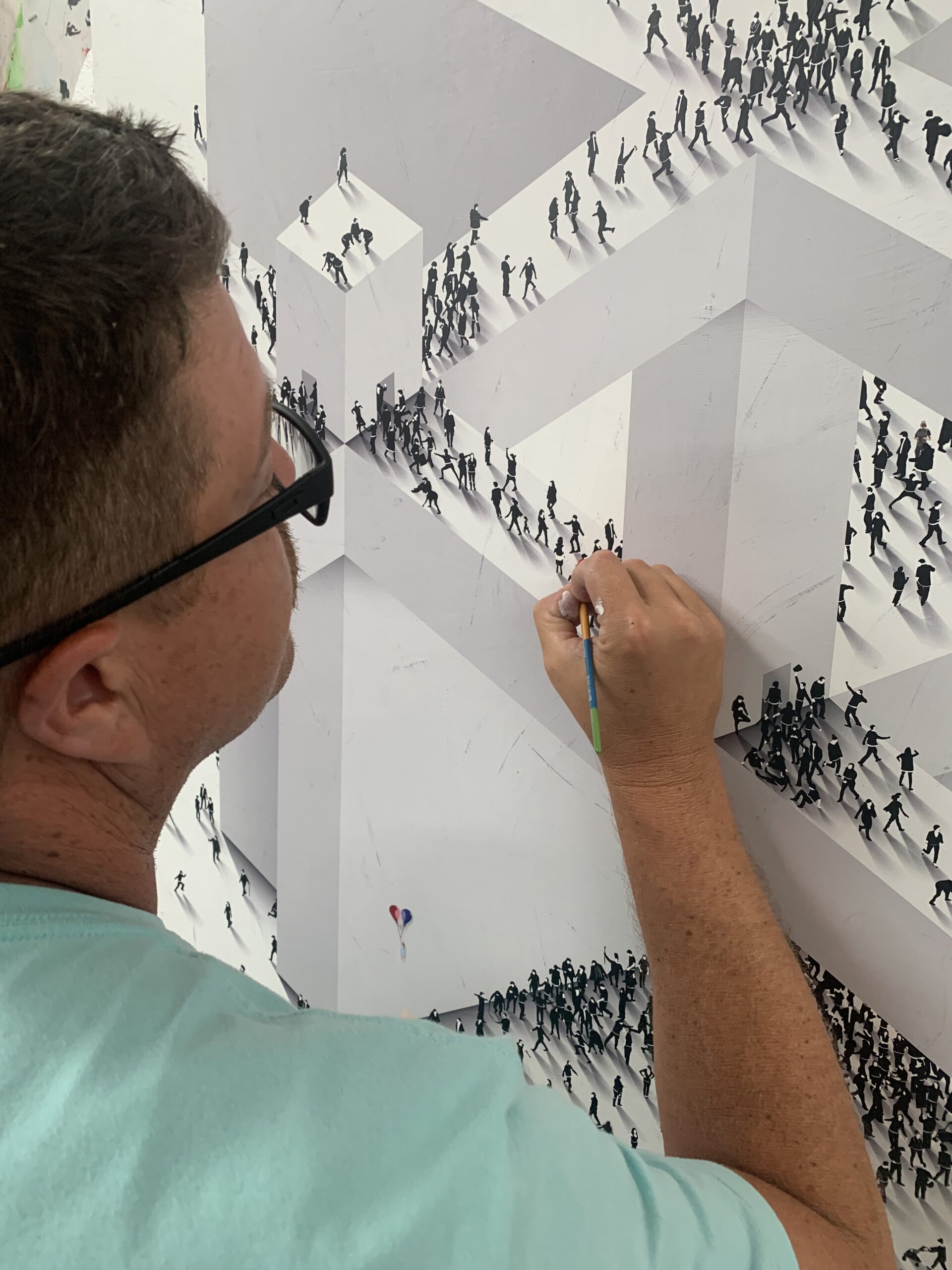 Craig Alan adding custom details to a piece of artwork from his Populus series. 